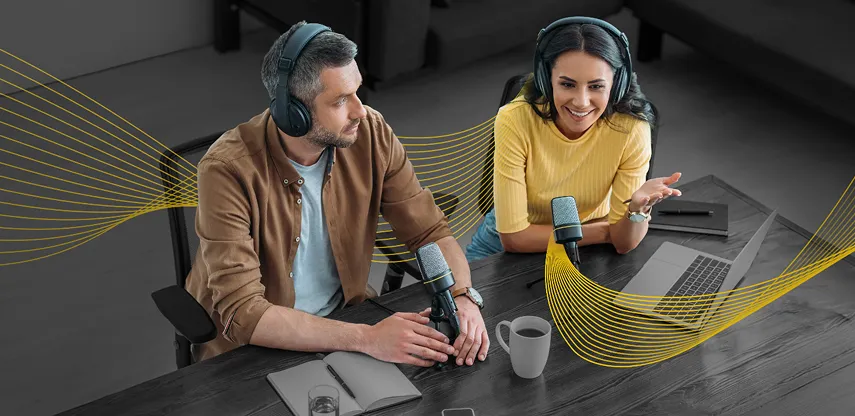 Male and female coworkers with a tablet working on a presentation