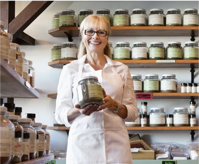 Woman holding a jar in a store
